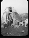 Image of Inuit woman, dog, puppy by tupik
